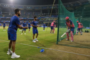 Generic IPL cricketers warm up before Mumbai Indians vs Rajasthan Royals as betting markets react to Bumrah resting news.