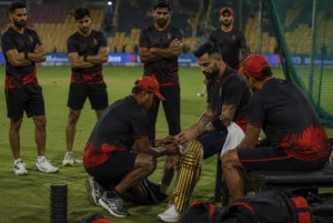 RCB players and staff react during a training session after a fitness concern involving Virat Kohli.