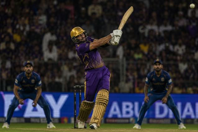 Generic power hitter attacks during a high-pressure IPL innings under lights.