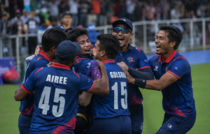 Players celebrate qualification for the Asian Games cricket tournament after a regional qualifying event.