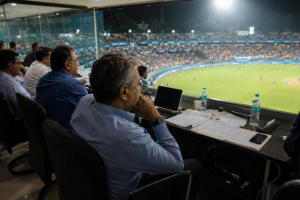 Generic cricket officials observe an IPL night match as scheduling discussions intensify after strong ratings growth.