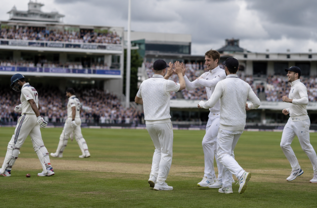 Fast bowlers celebrate during a wicket-filled opening day between England and New Zealand at Lord's.