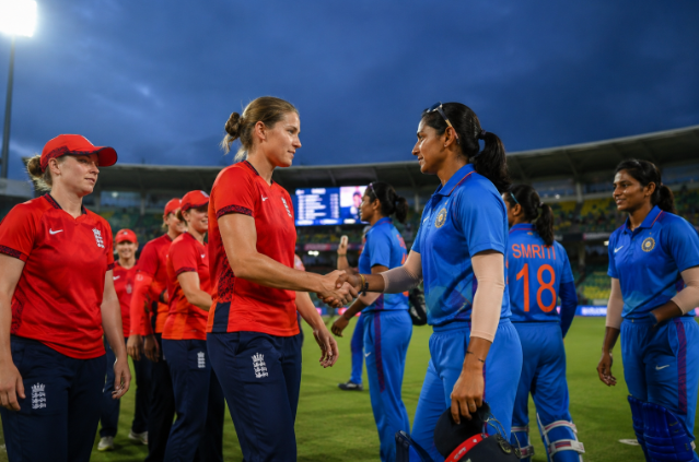England Women celebrate a successful chase against India Women in a T20I series decider.