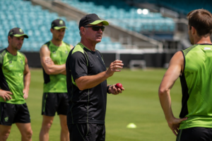 A coach watches Sydney Thunder players during pre-season training ahead of the new BBL campaign.