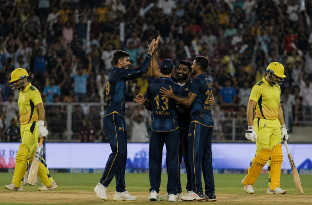 Gujarat Titans players celebrate during a dominant IPL win over Chennai as playoff betting markets react.