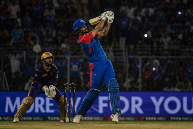 Generic top-order IPL batter attacks during a tense playoff-race innings.