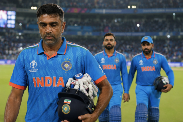 R Ashwin walks off after an ODI match with Virat Kohli and Rohit Sharma following behind.