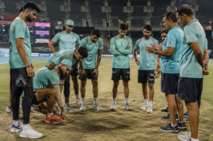 Lucknow Super Giants players assess pitch conditions before an IPL 2026 match.