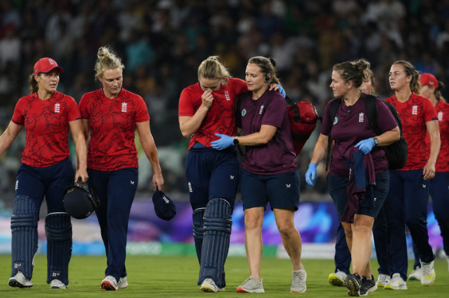 England Women players leave the field after Nat Sciver-Brunt suffered a calf injury during the T20 World Cup.