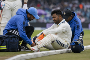 Generic Indian wicketkeeper-batter receives treatment during a major cricket match.