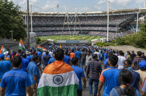 Cricket fans arrive before a major match as betting markets react to public support.