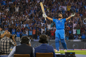 A batter celebrates a century as recent performances influence cricket betting markets