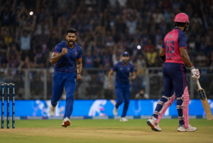 Generic fast bowler celebrates after taking a wicket during Rajasthan Royals’ IPL playoff-clinching victory.